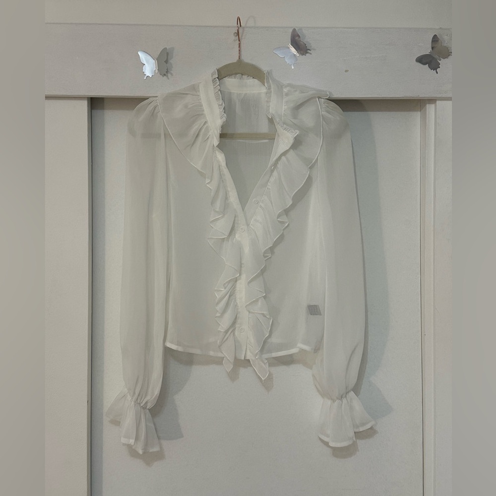 White ruffle blouse